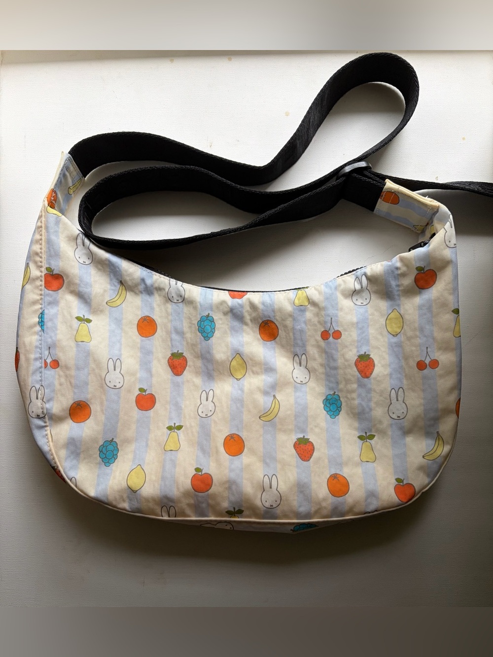 BAGGU Miffy Medium Crescent crossbody Bag in Cream striped and fruit print